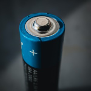 A double A battery. Photo by Mika Baumeister on Unsplash