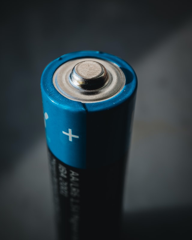 A double A battery. Photo by Mika Baumeister on Unsplash